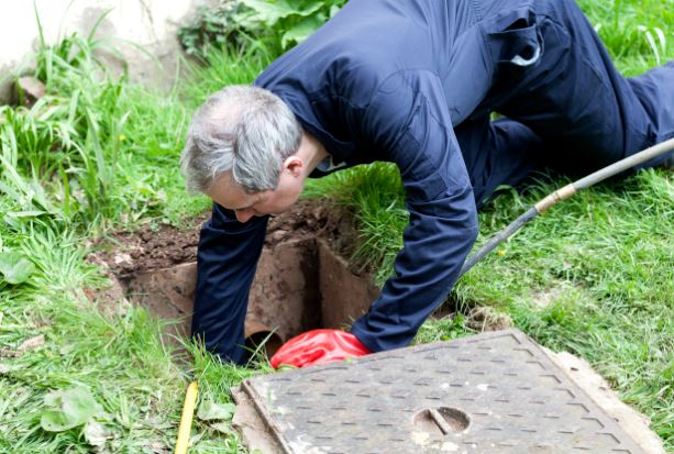 plumber working on main line drain
